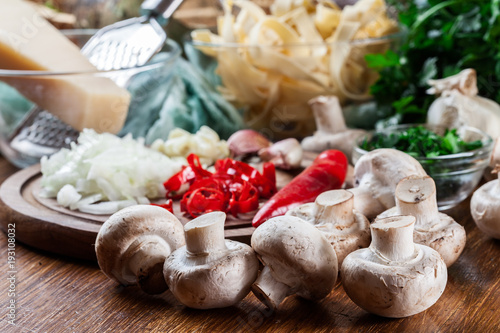 Ingredients ready for prepare tagliatelle pasta with champignon