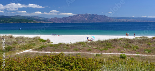 Tourists at the Langosteira white beach, Finisterre, Costa de la Muerte, Galicia, Spain, Europe photo