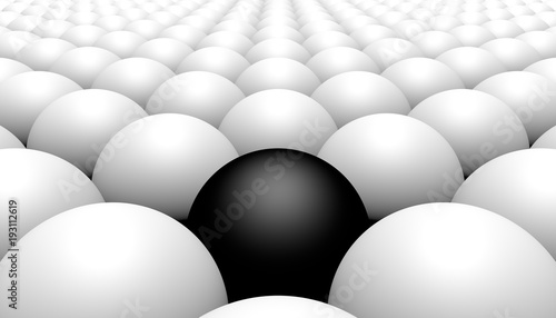 Black ball amongst white balls, concept of racism, 3d illustration