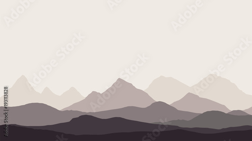 panoramic view of the mountain landscape with fog in the valley below with the alpenglow grey sky