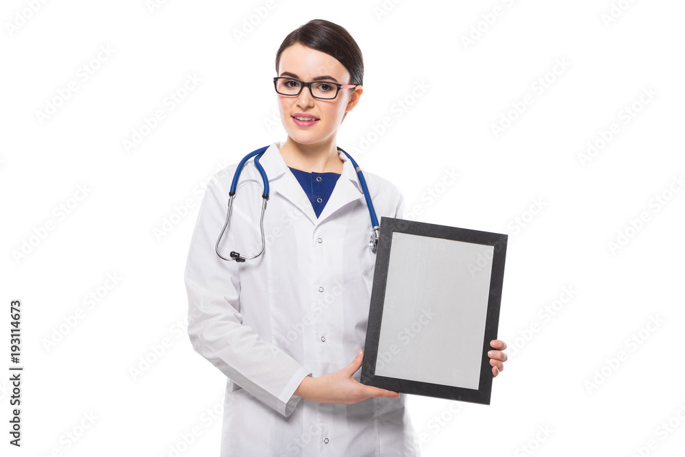 Successful young woman doctor with stethoscope holding frame in her hands in white uniform on white background Successful young woman doctor with stethoscope holding frame in her hands in white uniform on white background