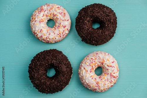 Four donuts, chocolate and white