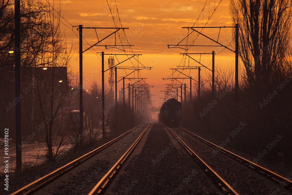 Train lines in a beautfiul morning with colourful clouds in background.