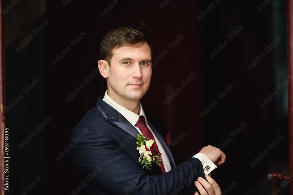 Handsome groom at wedding tuxedo smiling and waiting for bride. Happy smiling groom newlywed. groom at wedding day. Handsome groom at wedding tuxedo smiling and waiting for bride. Happy smiling groom newlywed. groom at wedding day.