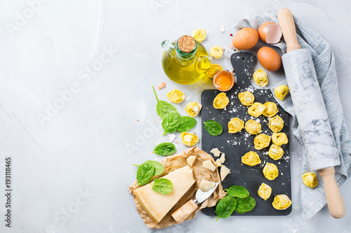 Fotografie Italian food and ingredients, handmade tortellini with spinach and cheese
