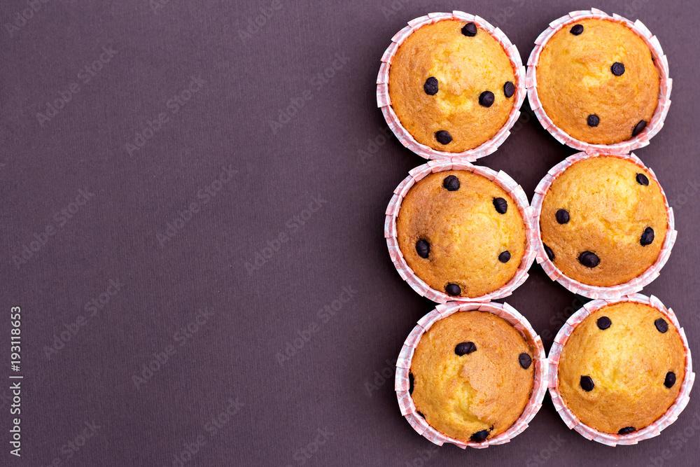 Homemade vanilla cupcakes with chocolate drops.