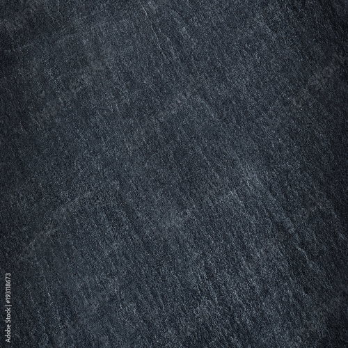 Dark grey / black slate stone background or texture. © prapann