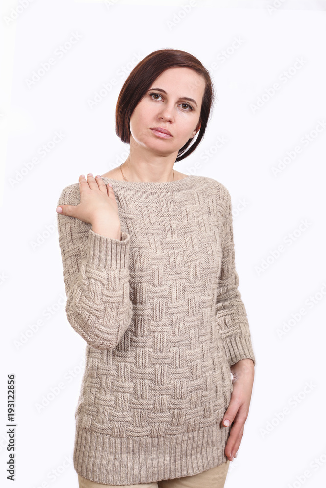 The girl the brunette in a sweater