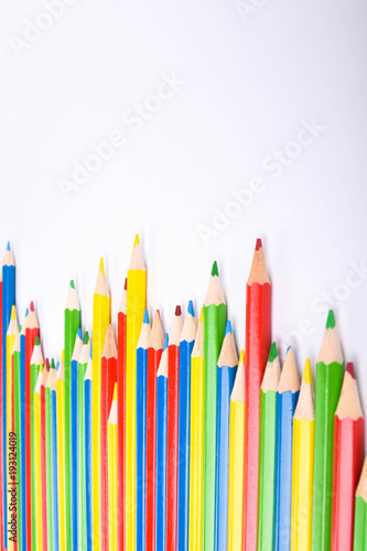  Colorful pencils pattern isolated on white background. Top view colorful of color pencils.Colored pencils, isolated on the white background. Color pencil with copy space isolated on white background,