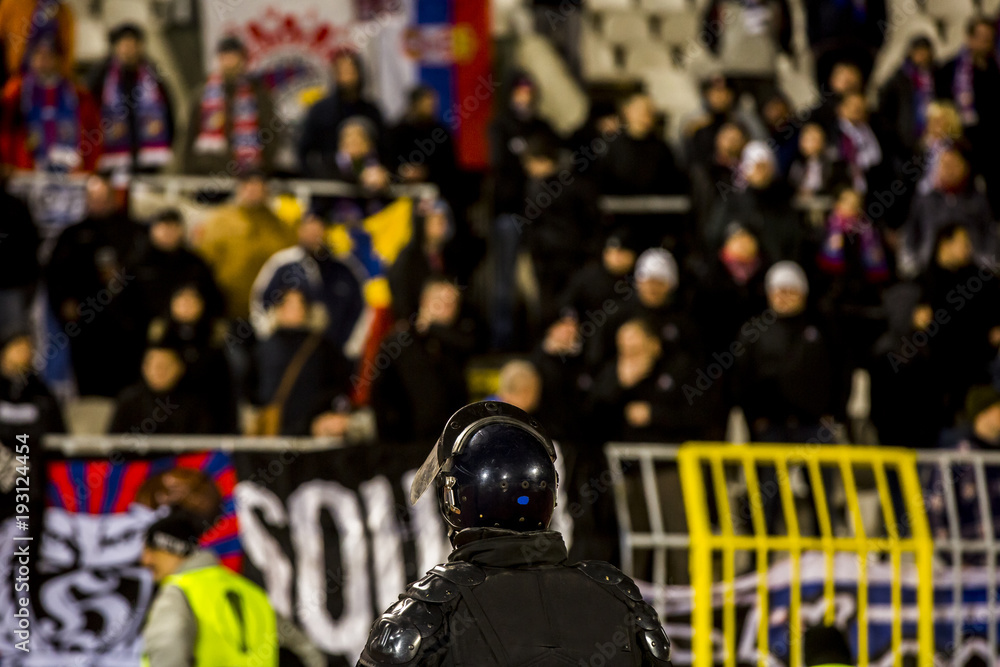 Obraz premium The police at the stadium event secure a safe match against the hooligans