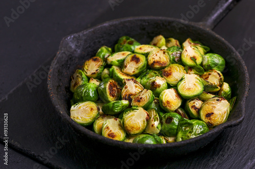Vegetarian cuisine. Brussels Sprouts roasted with olive oil. Copyspace