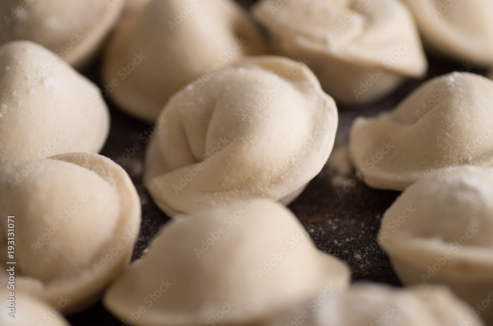 dumplings in flour on the table dumplings in flour on the table