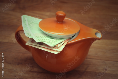 Hide money in a teapot