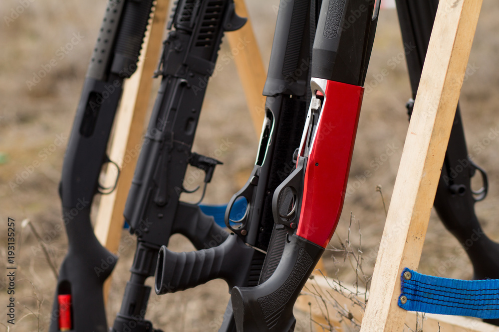 arm-stand with shotguns close up picture arm-stand with shotguns close up picture
