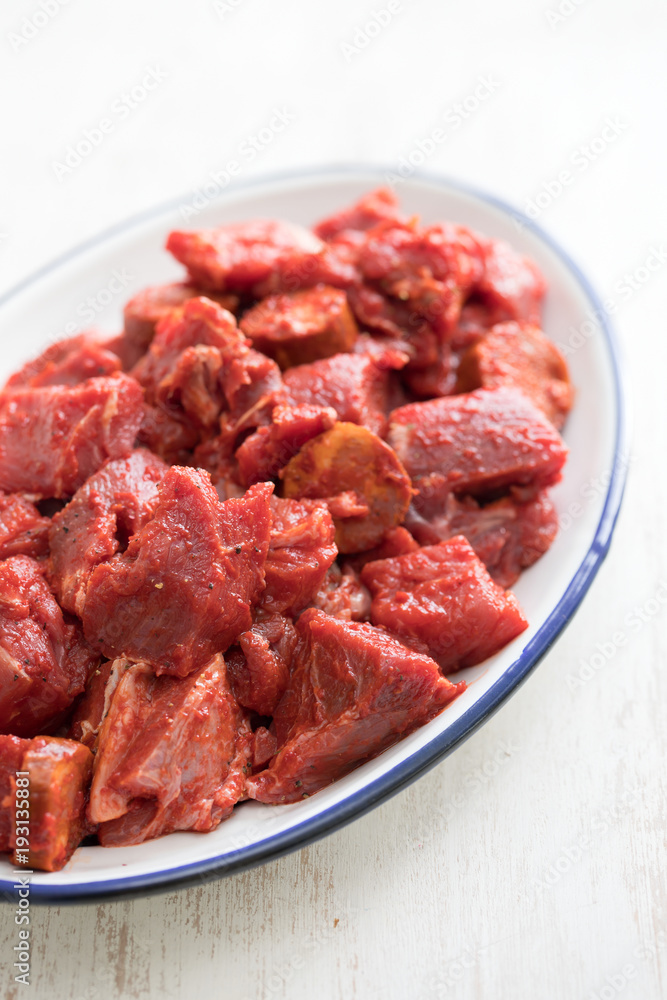 raw meat with sauce on dish raw meat with sauce on dish