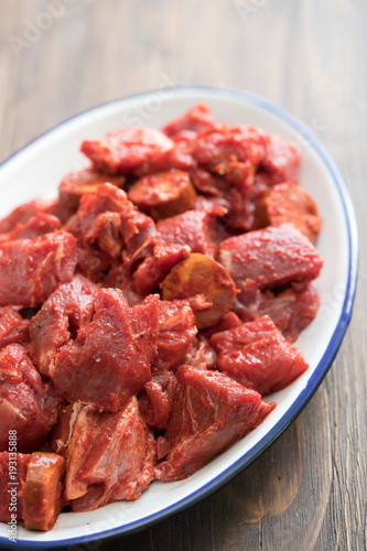 raw meat with sauce on dish