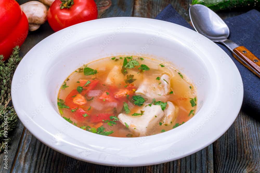 Fish soup on white plate Fish soup on white plate