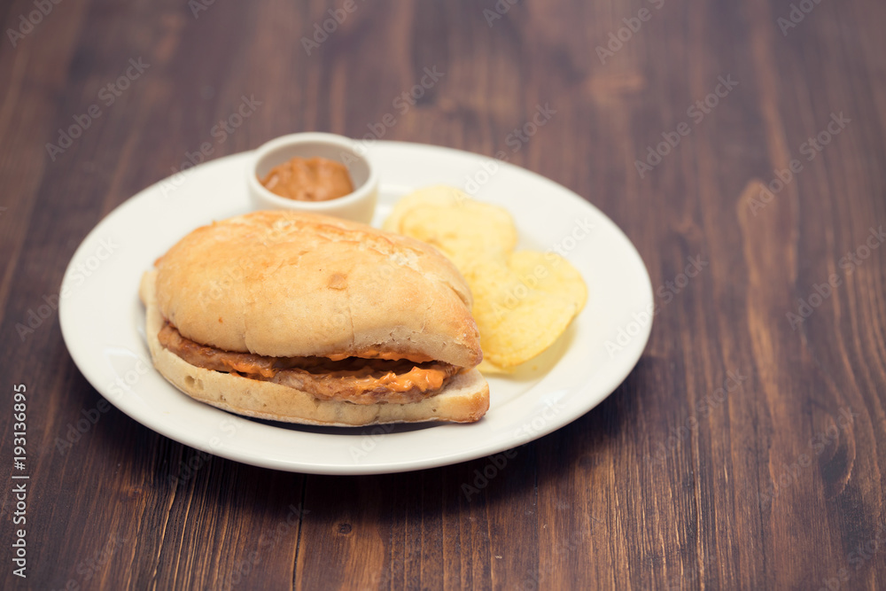 sandwich with meat  and potato on plate