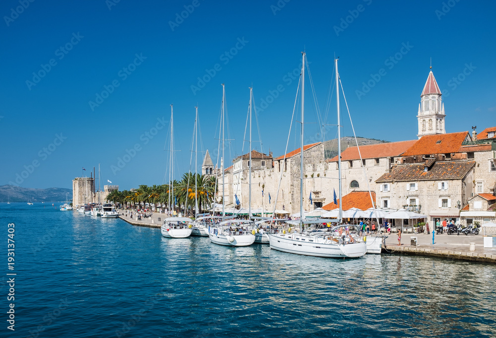 sailing boats on embankment in old town of Trogir, Croatia