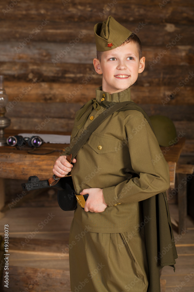Russian boy in the old-fashioned Soviet military uniform Photos | Adobe  Stock