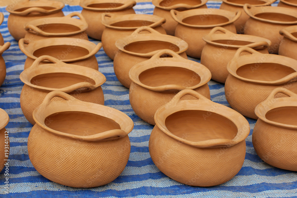 Red clay pottery ceramic vases on ground Red clay pottery ceramic vases on ground