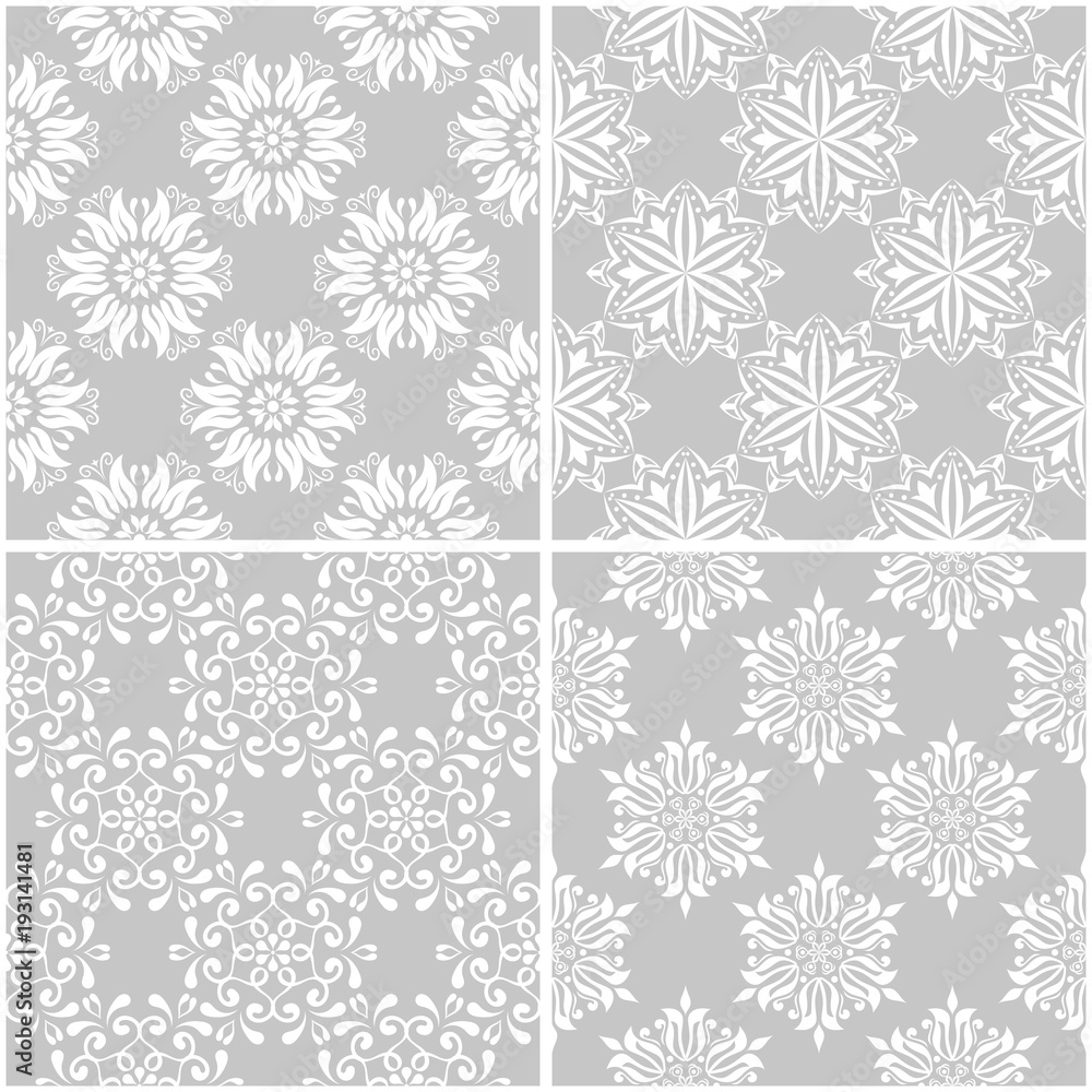 Floral patterns. Set of gray and white seamless backgrounds Floral patterns. Set of gray and white seamless backgrounds