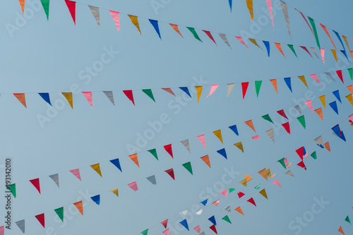 Colorful bunting flags with blue sky 