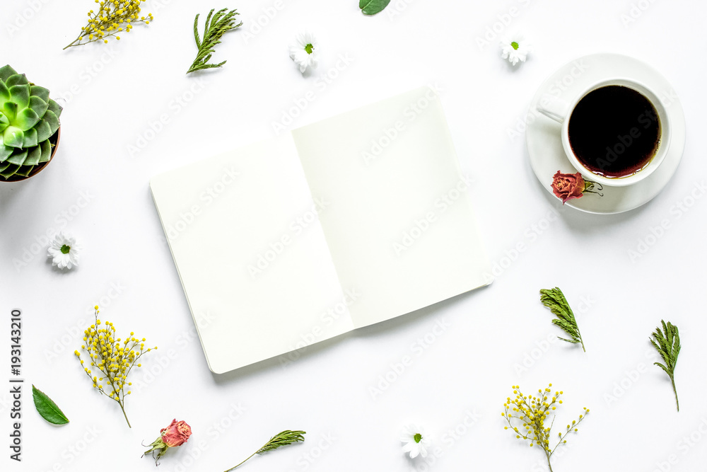 Notebook with cup of coffee on white background top view mockup Notebook with cup of coffee on white background top view mockup