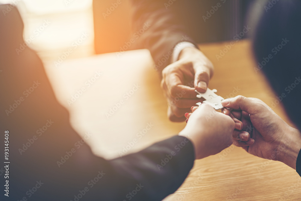 Obraz premium Teamwork of partners. Concept of integration and startup with puzzle pieces. double exposure