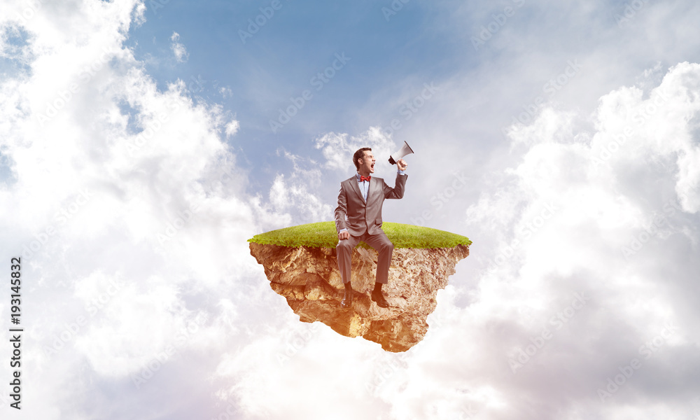 Businessman floating on island in sky and announcing something in loudspeaker