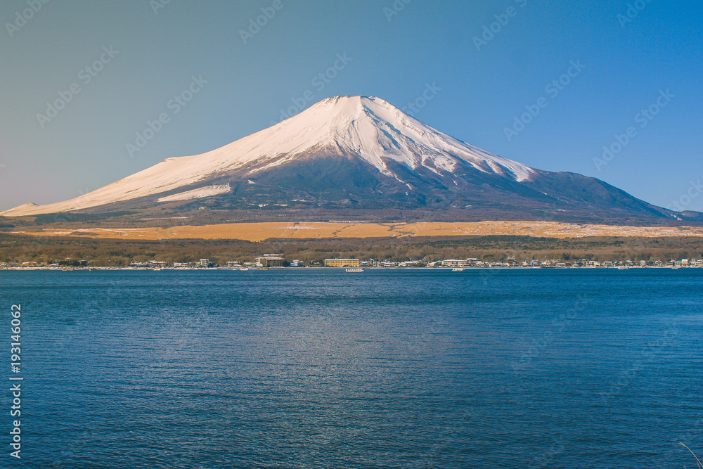 Beautiful landscape view of Fuji mountain or Mt.Fuji covered with white snow in winter seasonal at Kawaguchiko Lake, Japan.