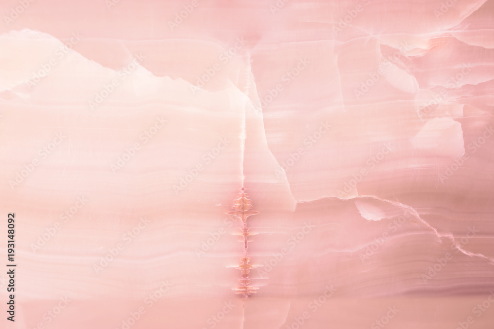 Lightened slices marble onyx. Horizontal image. Warm pink colors. Beautiful close up background