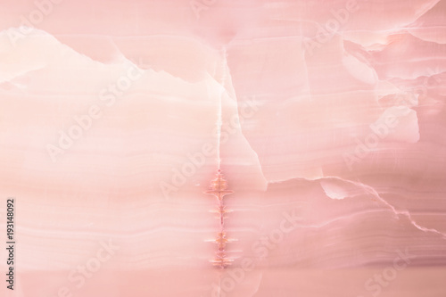 Lightened slices marble onyx. Horizontal image. Warm pink colors. Beautiful close up background