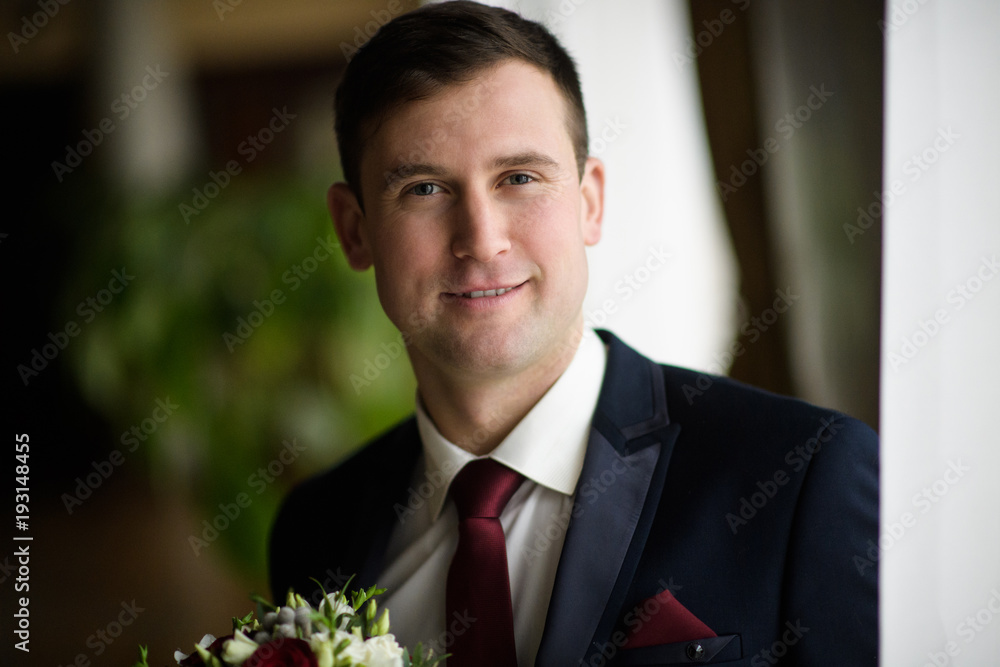 Handsome groom at wedding tuxedo smiling and waiting for bride. Happy smiling groom newlywed. groom at wedding day. Handsome groom at wedding tuxedo smiling and waiting for bride. Happy smiling groom newlywed. groom at wedding day.