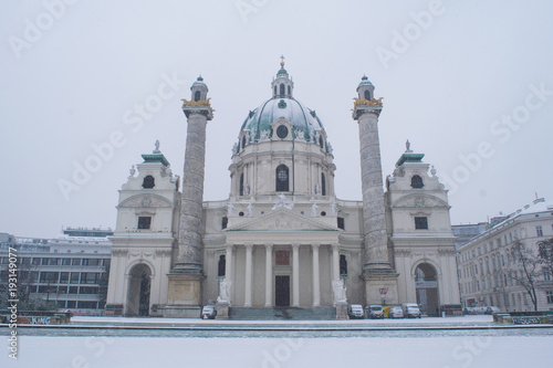 Snow covered grounds in front of Karlskirche in the city of Vienna, Austria photo