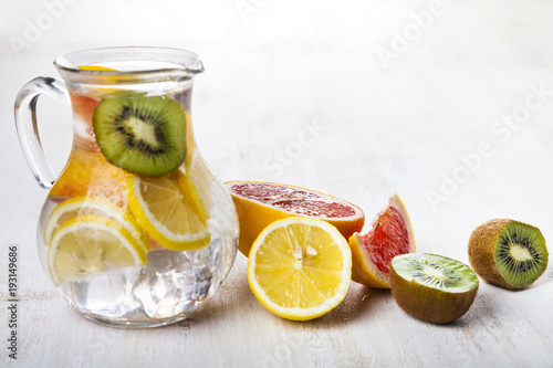 Refreshing ice cold water with lemon  kiwi and grapefruit