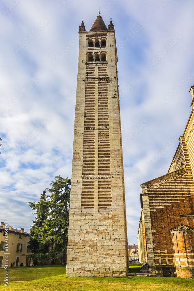 View of Basilica di San Zeno Maggiore bell tower in Verona. Basilica di San Zeno Maggiore - most important medieval church in Verona, was founded in V century and rebuilt in XII century. Italy.