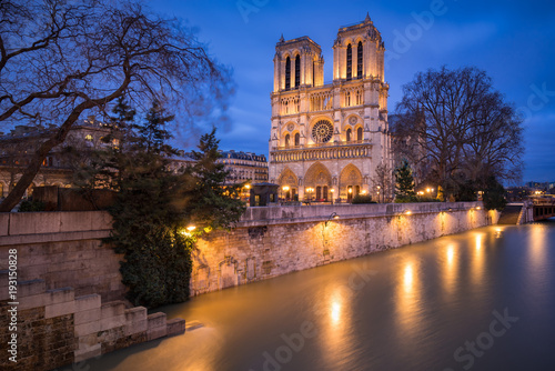 Notre Dame de Paris Catheral at dusk with the overflowing Seine River, 4th Arrondissement, Paris, France