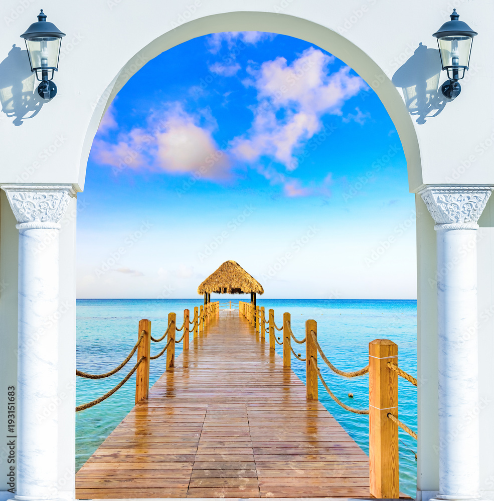 Obraz premium wooden open door arch exit to the beach caribbean dominican republic