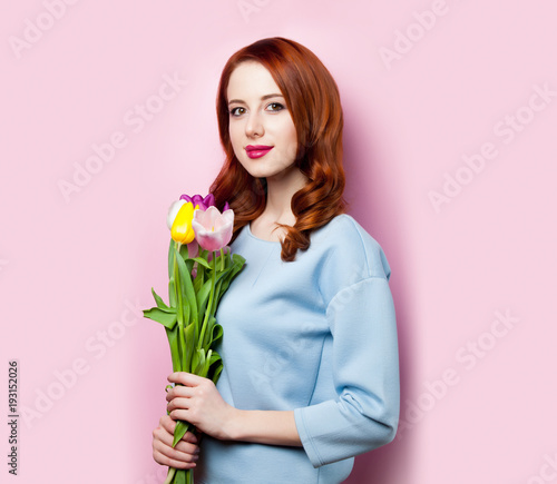 Young girl with bouquet of tulips
