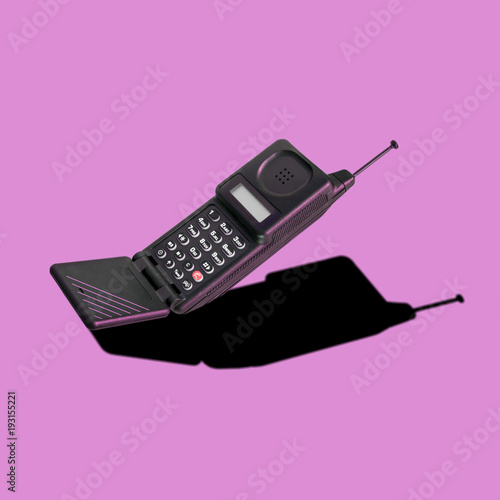 Old classic analog mobile phone nostalgia in punchy color, with aerial and microphone flip, for creative design cover, CD, poster, book, printing, gift card, flyer, magazine web & print