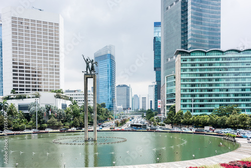 Full length view of Selamat Datang Monument placed in the middle of a fountain in a famous square of Central Jakarta