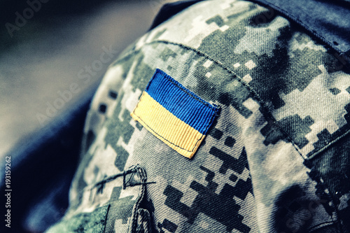 Fotografie military badge of ukrainian army with trident and yellow-blue flag