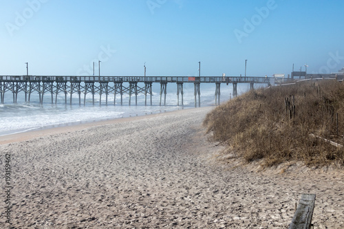 Open beach with pier © Rick