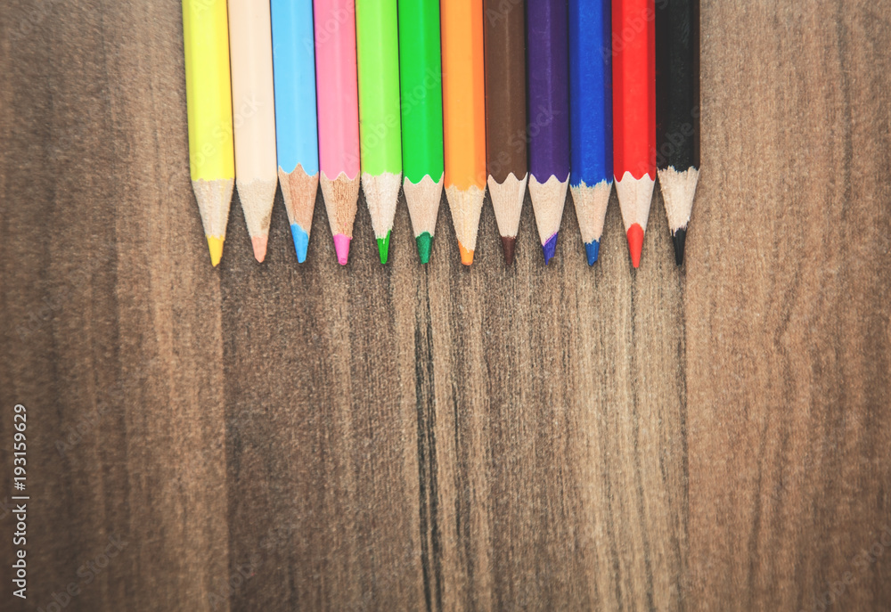Colorful pencils on the wood background. Colorful pencils on the wood background.