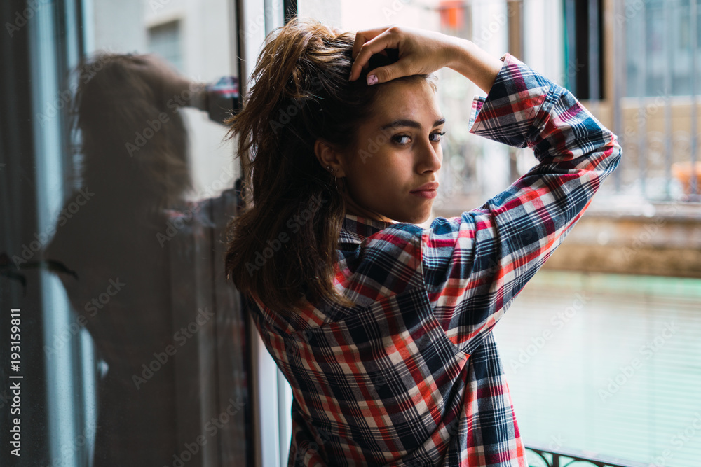 Young attractive woman at window Young attractive woman at window