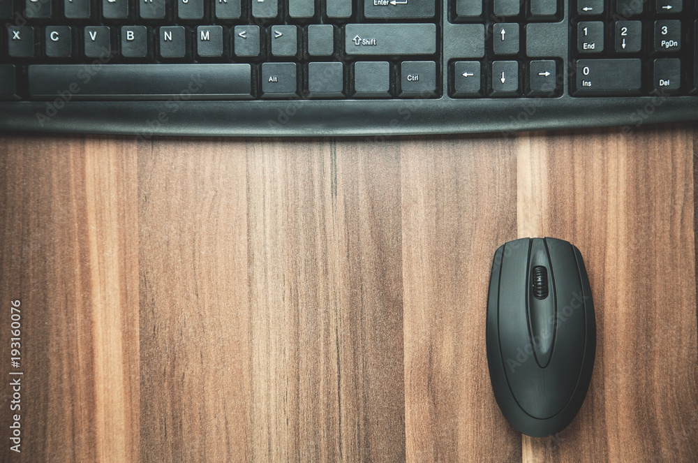 Computer keyboard with mouse on the wood background. Computer keyboard with mouse on the wood background.