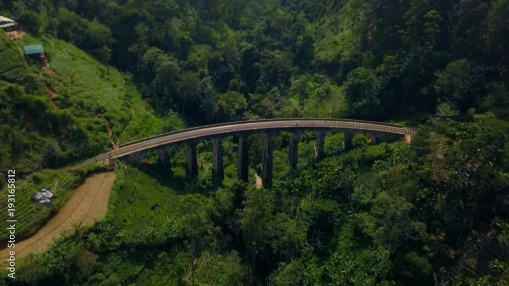 Nine Arches Bridge in lush forest valley Ella Sri Lanka at sunrise drone footage Nine Arches Bridge in lush forest valley Ella Sri Lanka at sunrise drone footage