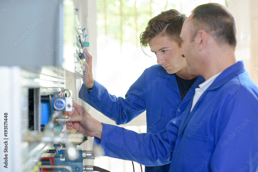 Obraz premium technician operating advanced technology