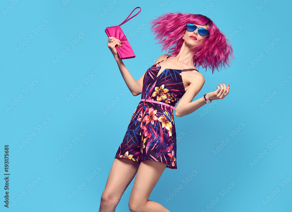 Glamour Beautiful Lady. Party fashionable Hairstyle. Fashion woman Dance. Young Playful female model with Pink Hair in Stylish fashion Outfit. Trendy Sunglasses, Heels Glamour Beautiful Lady. Party fashionable Hairstyle. Fashion woman Dance. Young Playful female model with Pink Hair in Stylish fashion Outfit. Trendy Sunglasses, Heels